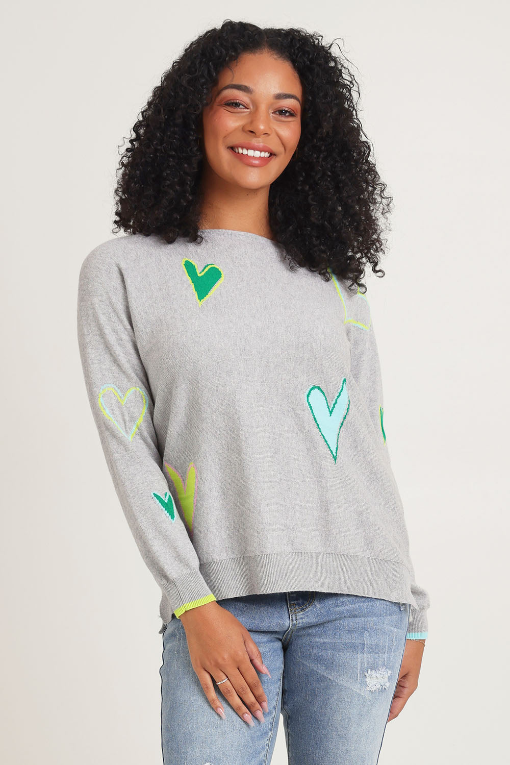 Model Ziara wearing size S of the Intarsia Hearts Cotton Cashmere Jumper in colour Marl (Grey), from the front, cropped image